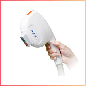 Hand holding white and orange handheld laser hair removal device with cord